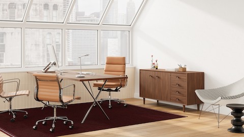 Private office featuring Eames Soft Pad, Executive Height in tan leather and Nelson Basic Credenza in walnut.