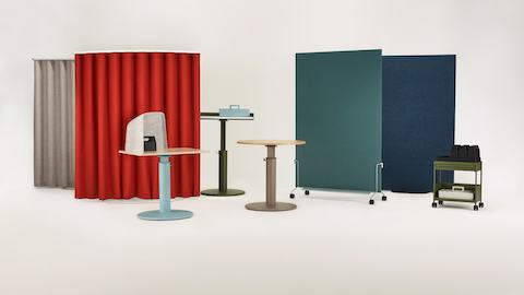 An assortment of OE1 Workspace Collection products in bright colors, including freestanding curtains, sit-to-stand tables and storage.