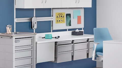 A wall of Co/Struc modular storage components. Select to go to the Co/Struc System product page. 