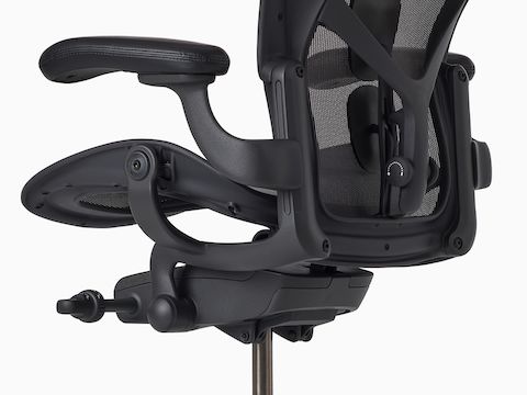 Rear-angle view of an Aeron ESD Stool with a granite frame and suspension and a polished base.