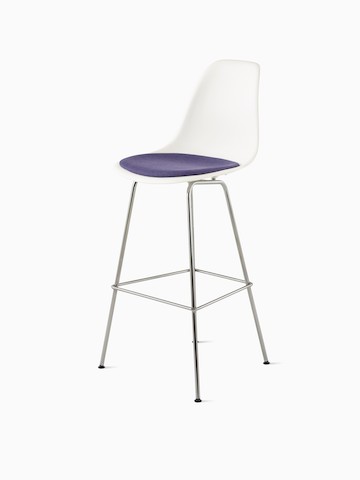 Three-quarter rear view of a light blue Eames Molded Plastic Stool. 