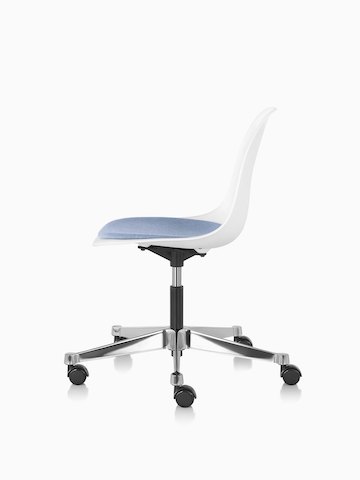 Side view of Eames Task Chair with blue upholstered seat pad and white plastic shell.