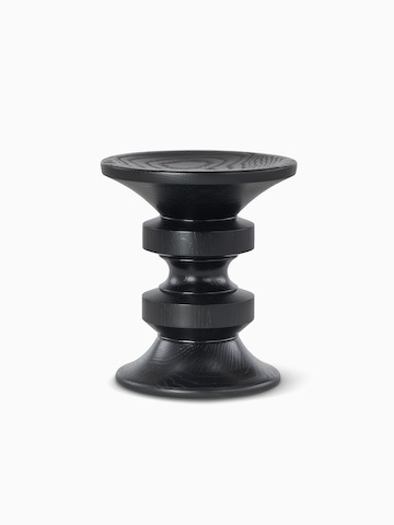 A D-shaped Eames Turned Stool in ebony ash.