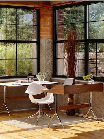 Home office featuring a white Nelson Swag Leg Armchair between a Nelson Swag Leg Desk and Table.