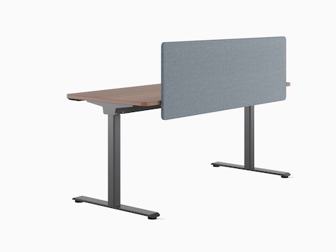 Back view of a freestanding Nevi Sit-to-Stand Desk with dark grey legs, a dark worksurface and a grey fabric screen.