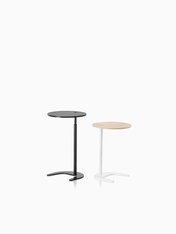 Two Plex work tables – one black and one with a white base and tan top.