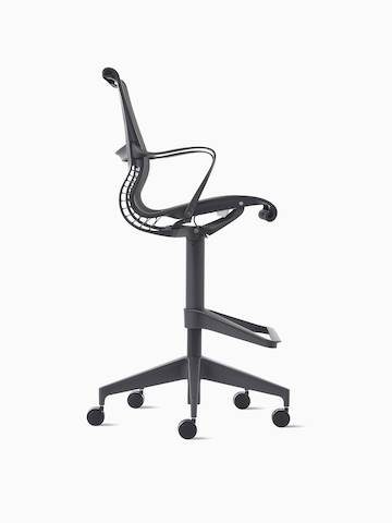 Side view of a Setu Stool with arms in dark grey.