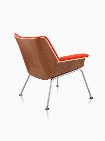 Three-quarter rear view of a Swoop plywood lounge chair with red upholstery.