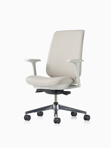 A Verus Chair upholstered in grey fabric, viewed from the front at an angle.