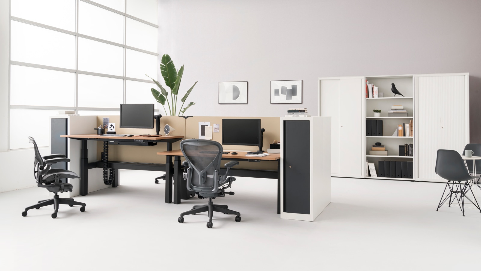 CK Storage high cabinets sit along the wall. In the foreground, a CK2 Tower Storage unit accompanies a cluster of four Augment Ratio bench tables.