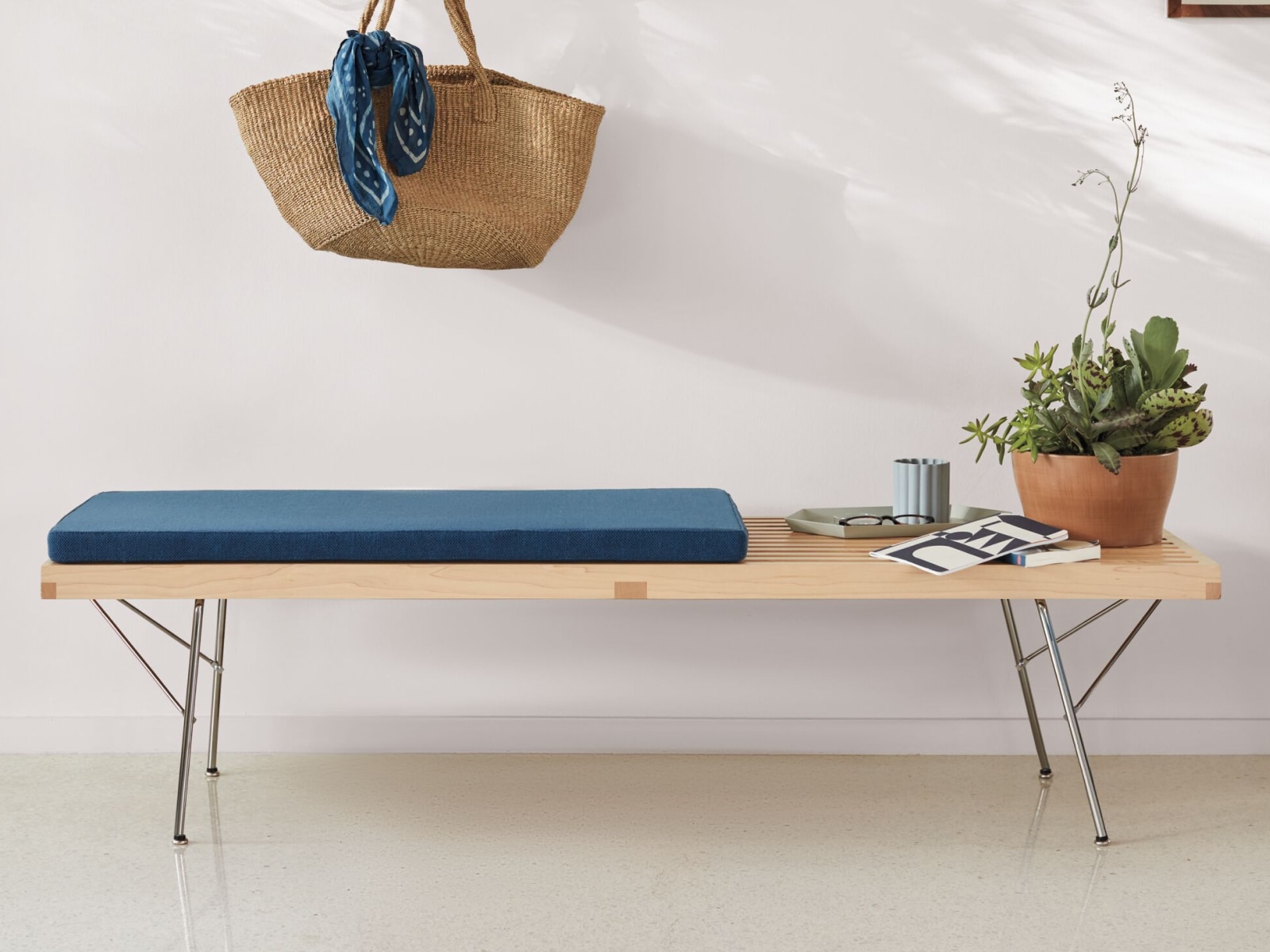 A Nelson Platform Bench with a metal base and seat pad.