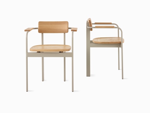 Two Betwixt Chairs with grey frames, oak seats and backrests.