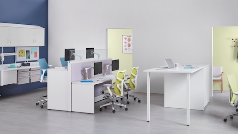 Co/Struc modular storage components, light blue Sayl stools, and green Mirra 2 office chairs in a caregiver work environment.