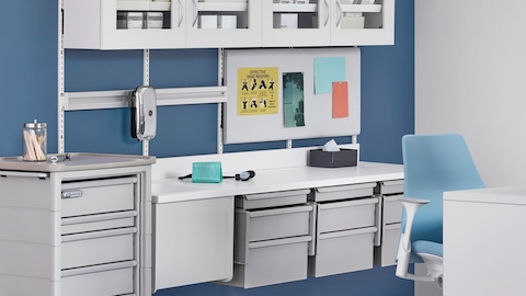 A wall of Co/Struc System modular storage components and a mobile Procedure/Supply Cart.