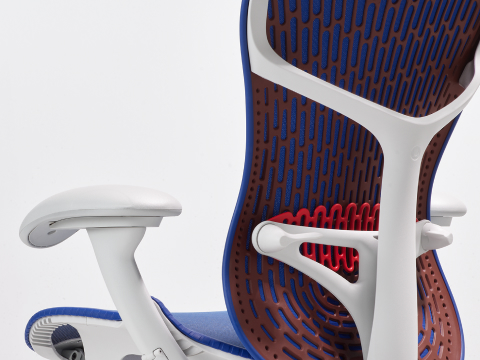 Rear angle view of a Mirra 2 chair with a Butterfly back in ultramarine color-block and alpine frame.