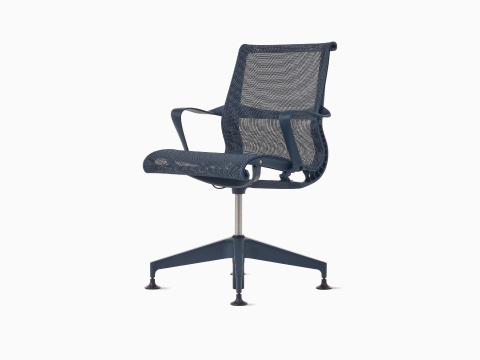 Front-angle view of a Setu Side Chair with fixed arms in dark blue.