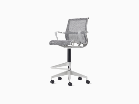 Front-angle view of a Setu Stool with fixed arms, a light grey frame, silver alloy base and light grey suspension.