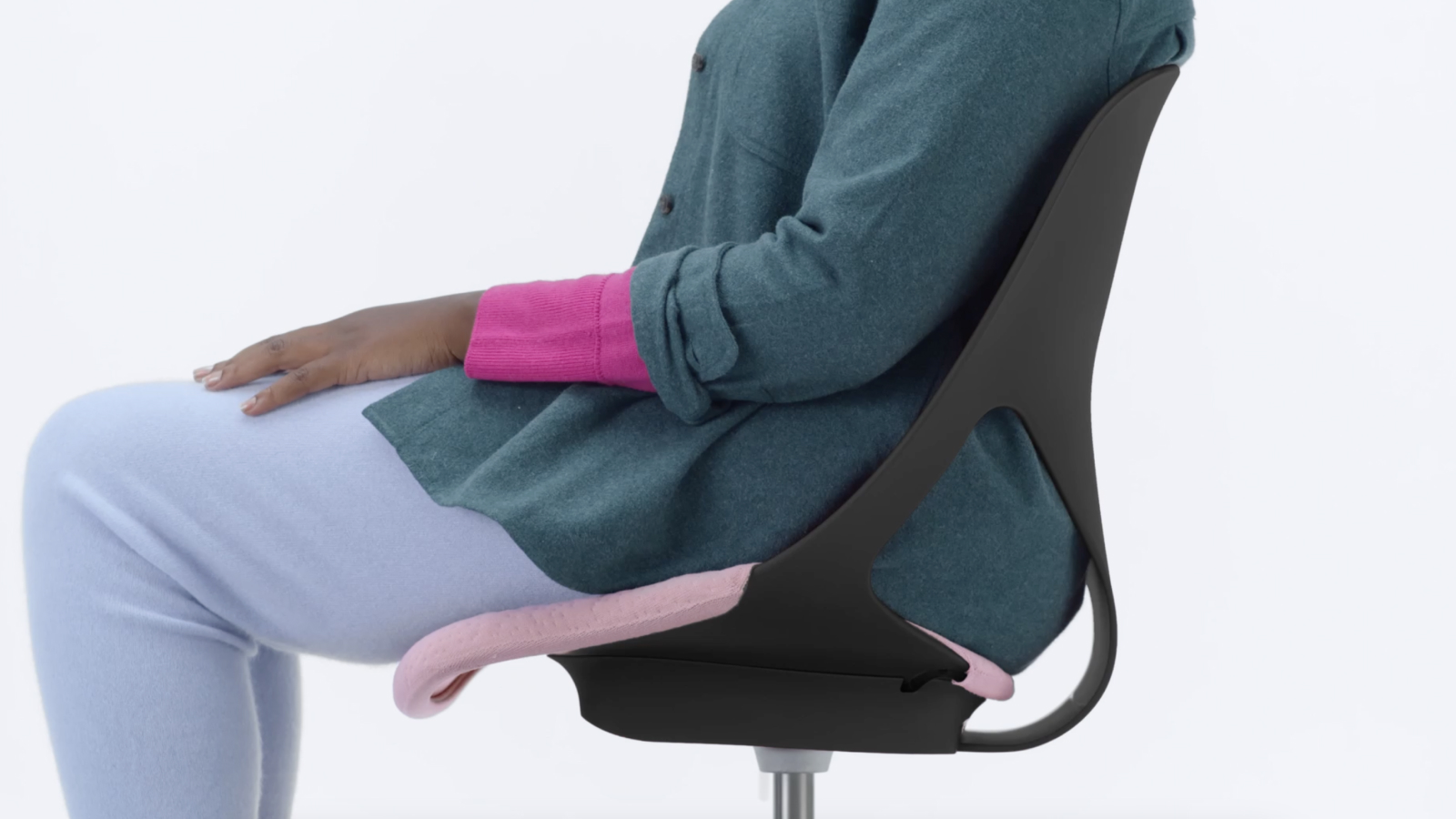 Side view of Zeph stool with a person sitting in it.