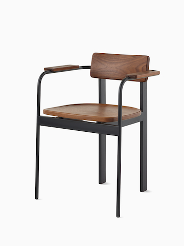 A Betwixt Chair with a walnut backrest, seat and arms with a black frame.