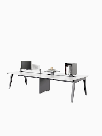 Byne System with Optimis legs and a universal middle leg in a 4-seat bench setting, with toolbars mounted with different accessories. Select to go to the Byne System product page.