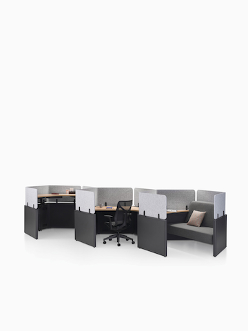A group of Catena Office Landscape workstations in a honeycomb configuration with black Aeron Chairs.