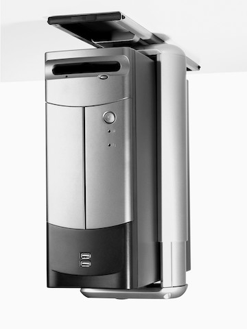 A computer CPU mounted beneath a work surface.