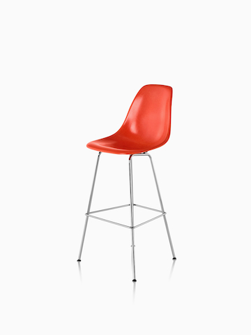Red Eames Molded Fiberglass Stool. Select to go to the Eames Molded Fiberglass Stool product page.