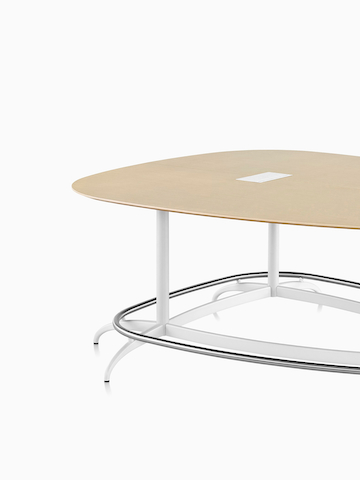 A teardrop-shaped Exclave conference table. Select to go to the Exclave product page.