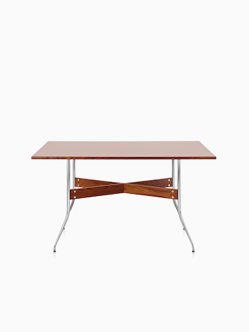 A Nelson Swag Leg Table with a medium veneer top.