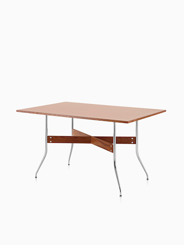 A Nelson Swag Leg Table with a medium veneer top. Select to go to the Nelson Swag Leg Desk and Tables product page.