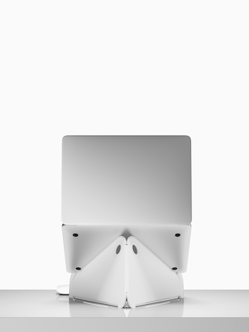 Back view of an open laptop raised to an ergonomic level on an Oriupra Laptop Stand. Select to go to the Oripura Laptop Stand product page.