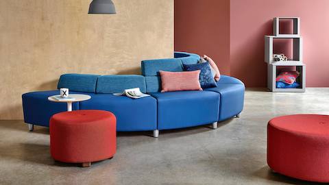 A half-circle configuration of the Steps Lounge System, featuring blue modules with varying back heights.