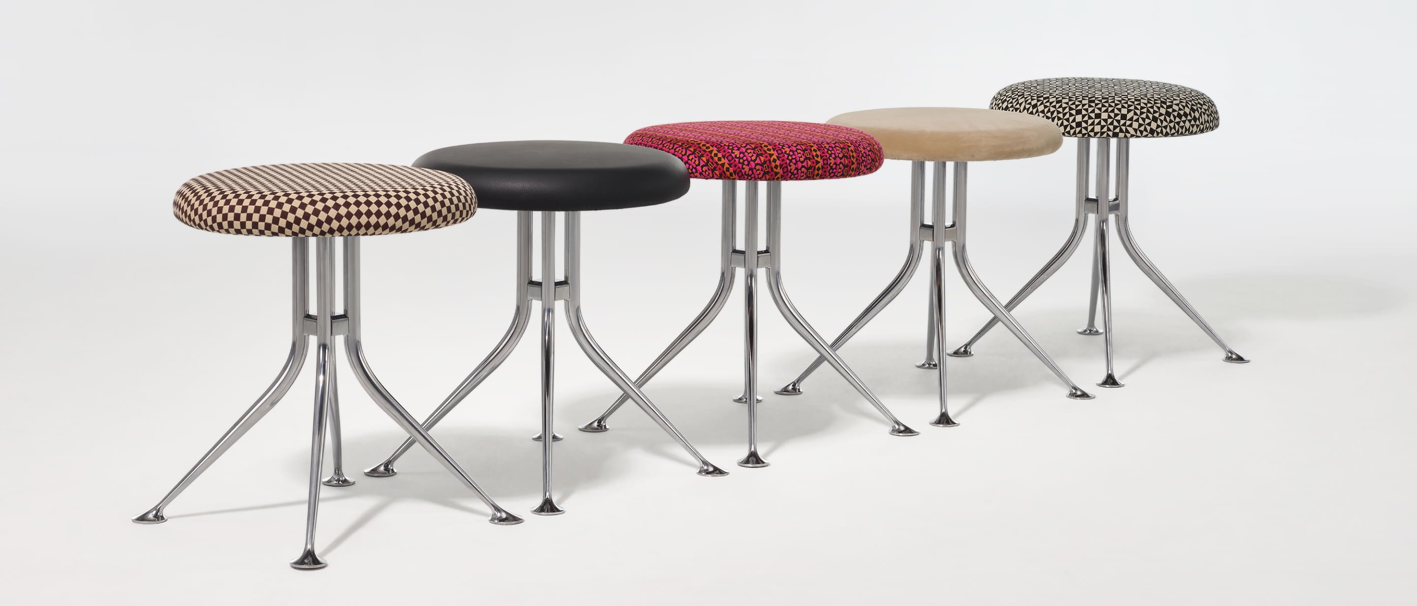 A group of Girard stools showing the variety of textiles that can be applied to the top.