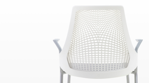 Rear view of the suspension back on a white Sayl Side Chair.